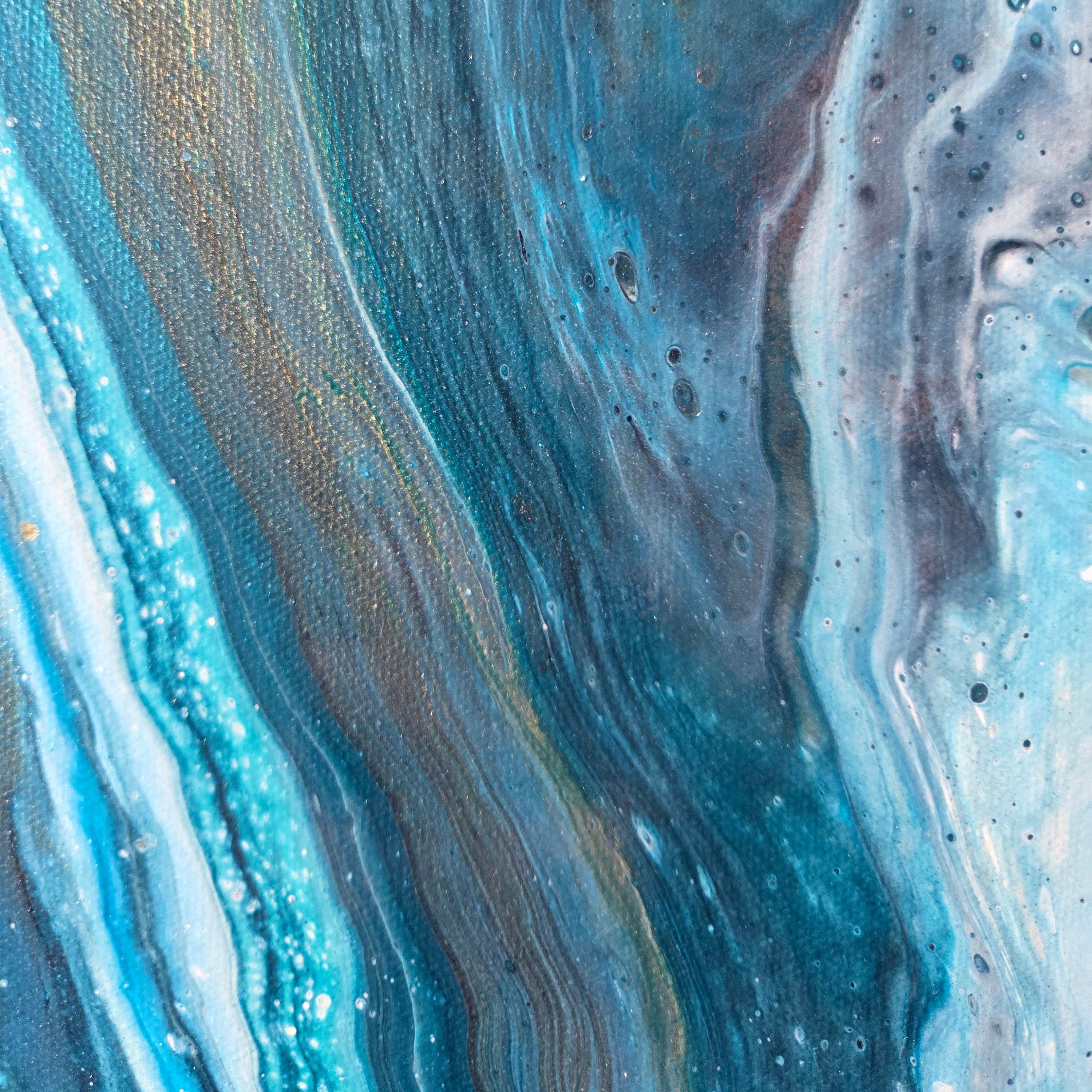 Close-up of a marbled blue and gold pattern.