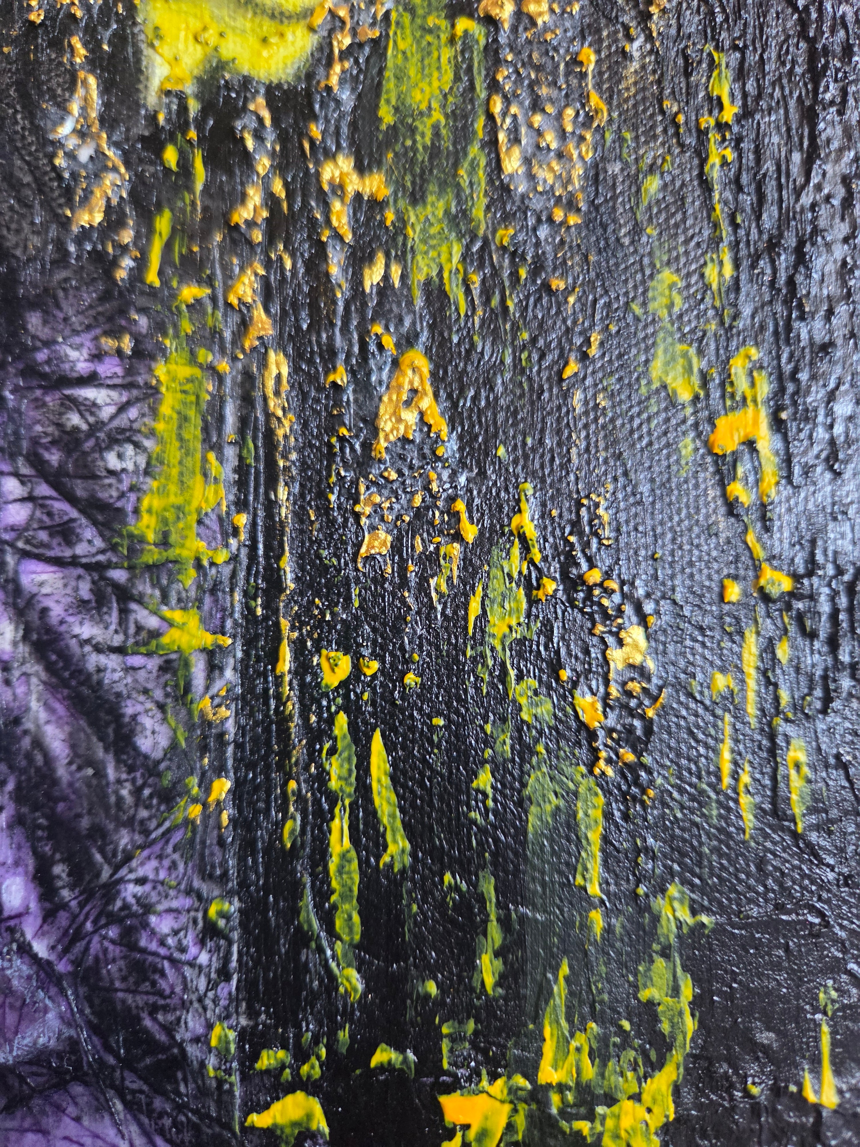 Abstract art with black, yellow, and purple colors on a textured surface