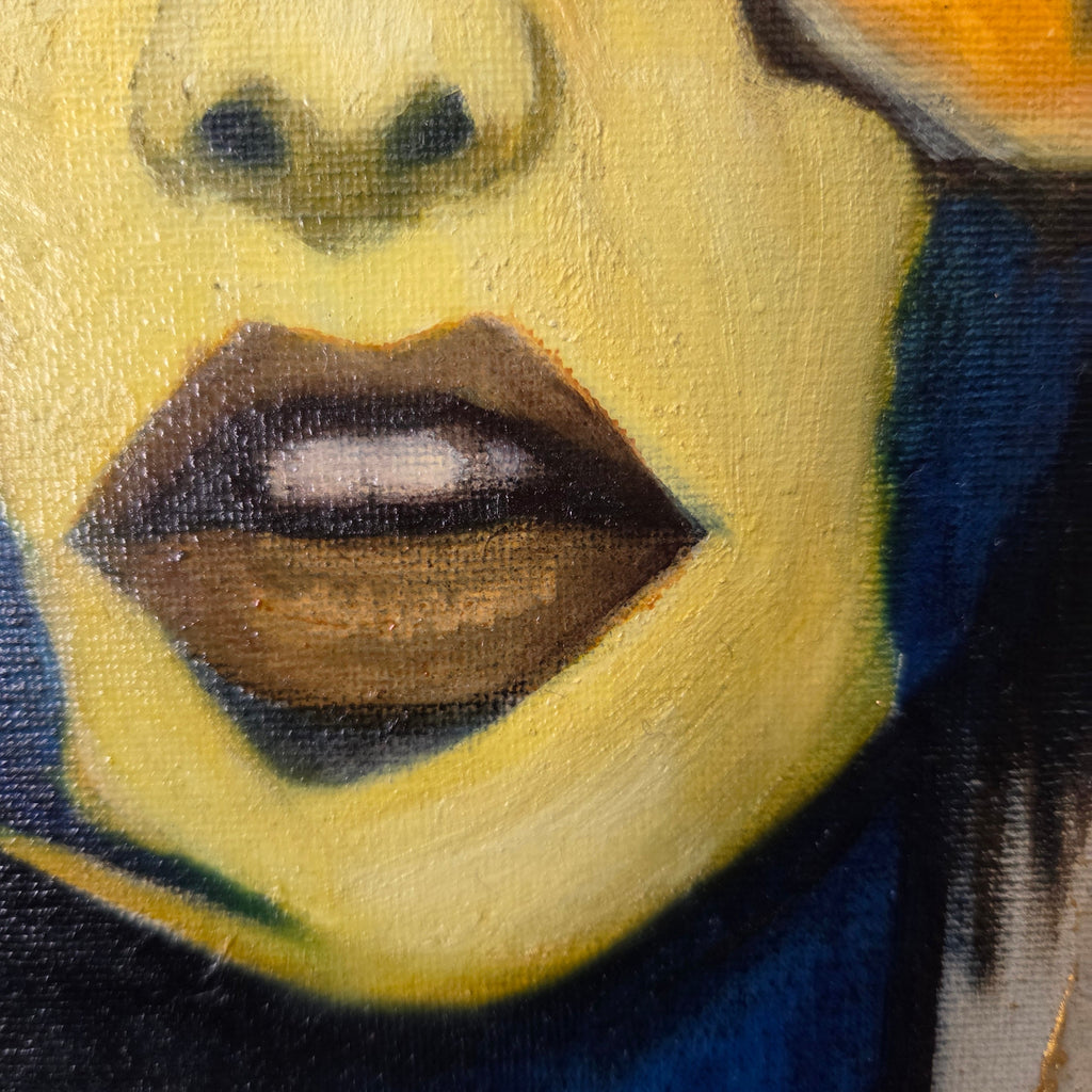 Close-up of a portrait where the lips and nose are emphasized
