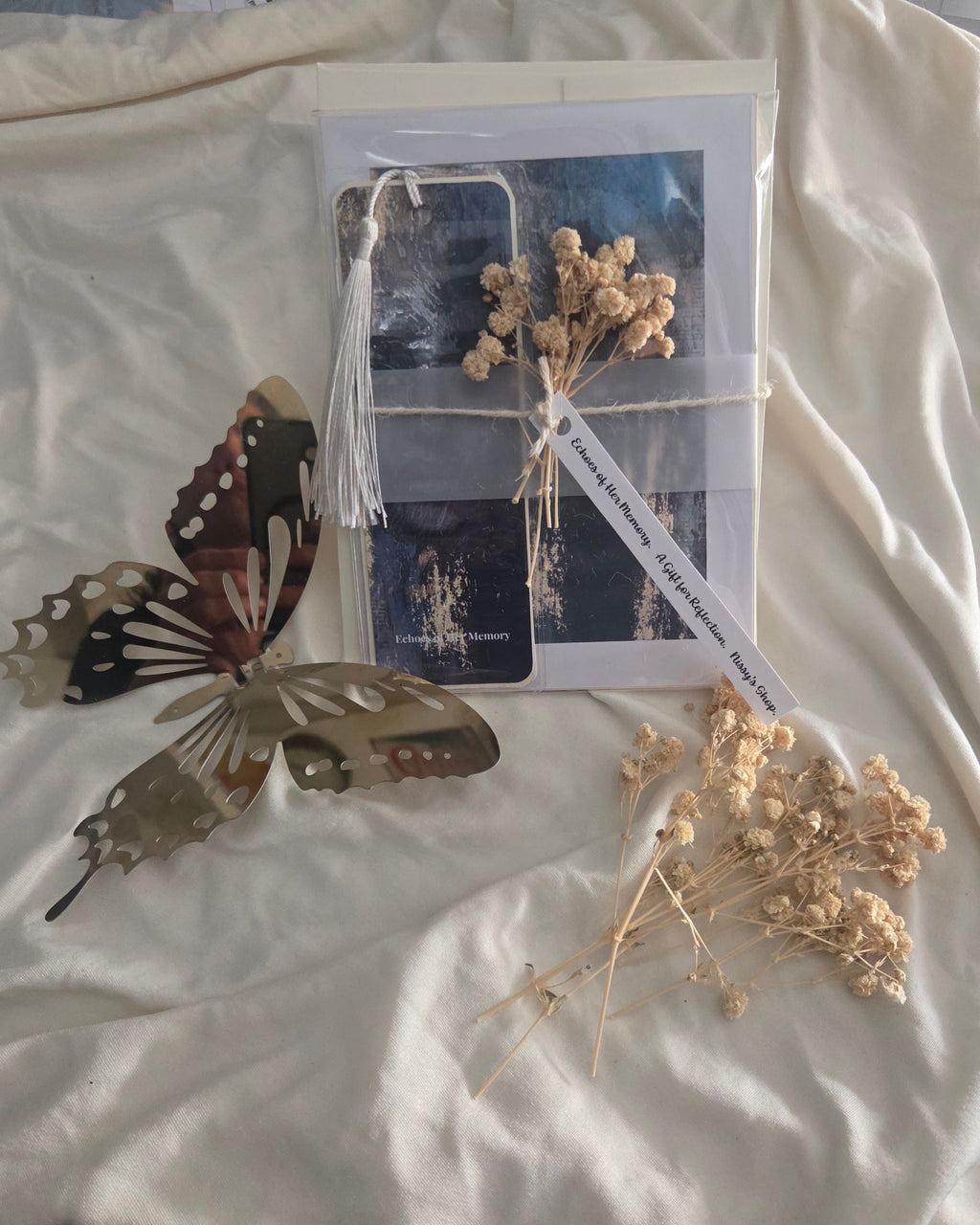 Bundle package with dried flowers and label inside a transparent protective bag. Includes an ivory envelope